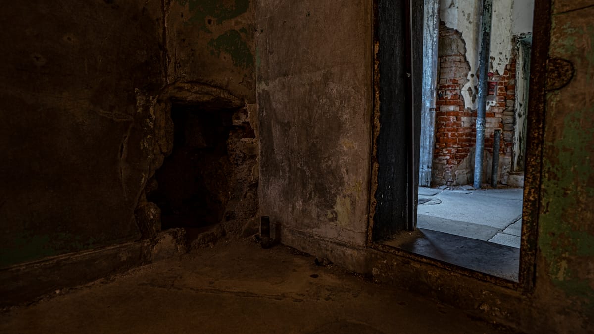 A hole remains in the wall at eastern state penitentiary, remnants of successful tunneling escape attempt