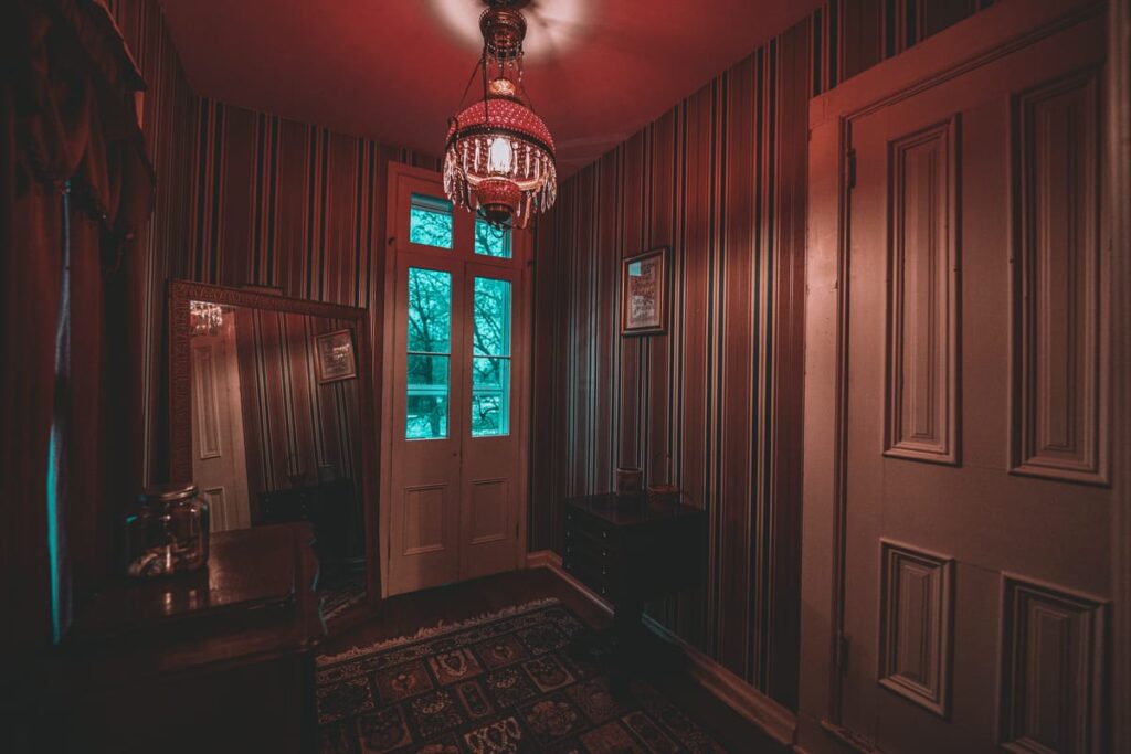 An antique lamp glows red as a storm rolls in to Jerseyville, Illinois