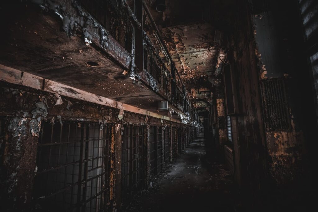 A crumbling cellblock where humming and singing are sometimes heard within the haunted Old Joliet Prison in Illinois