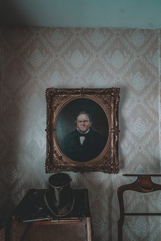 Portraits on the walls seem to follow you with their eyes