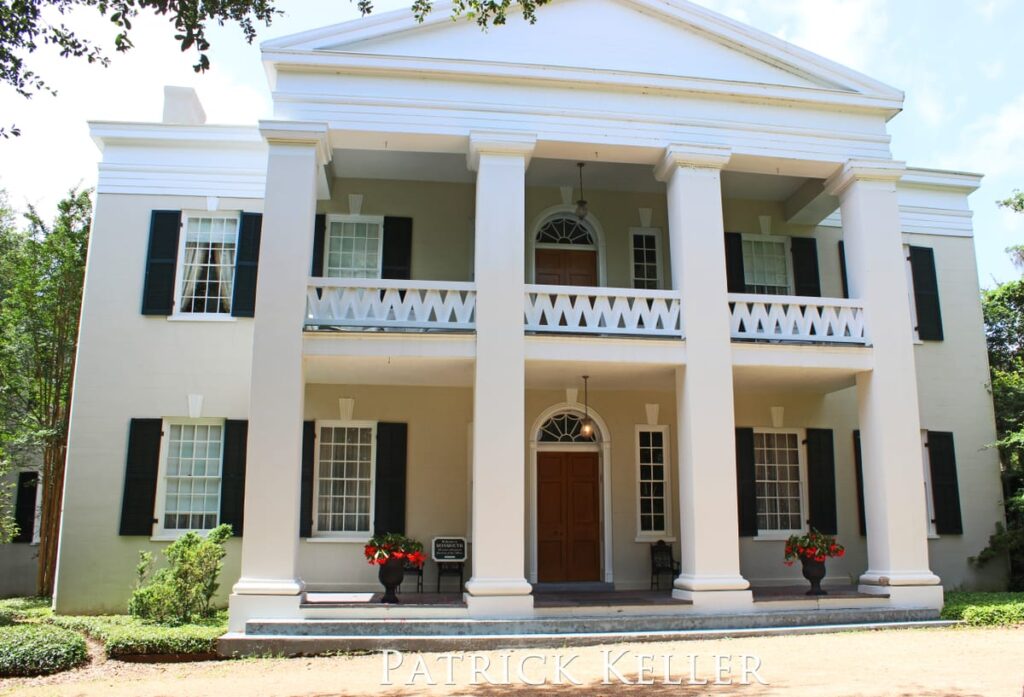 The looming facade of Monmouth Plantation